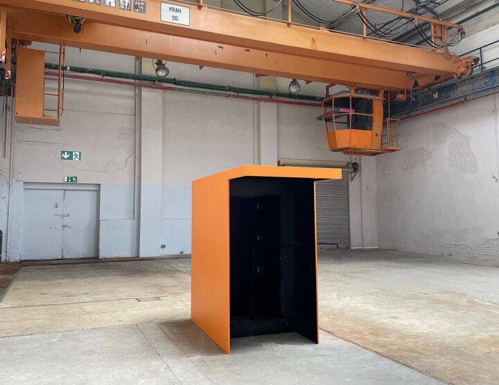 The physical booth housing the installation.
