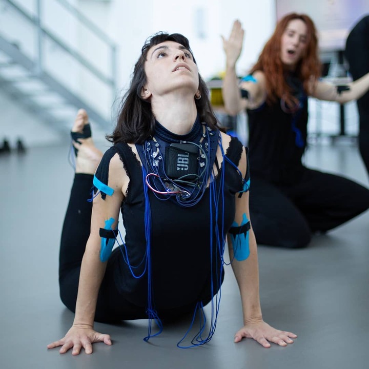 Dancer wearing wearable technology neck piece by Mika Satomi, transforming movement to sound